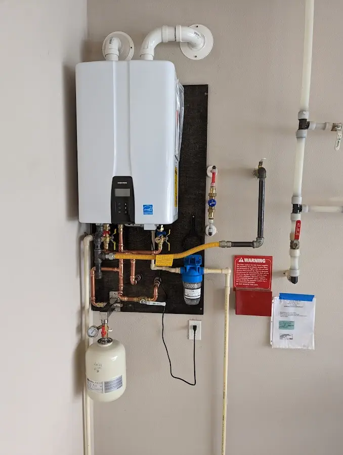 Professional plumber installing copper piping in a Shady Hills home